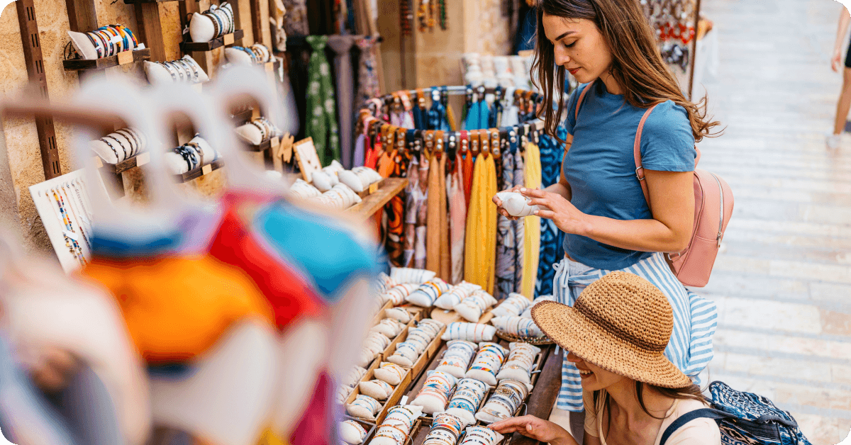 A person choosing souvenirs.