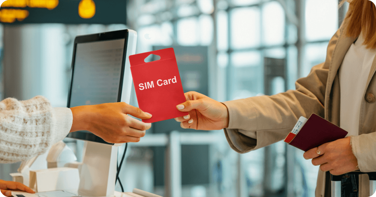 A person purchasing a SIM card in a London Airport kiosk