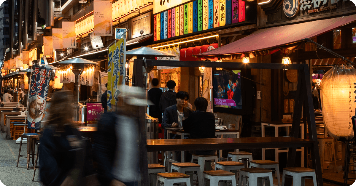 A person eating at a Japanese restaurant