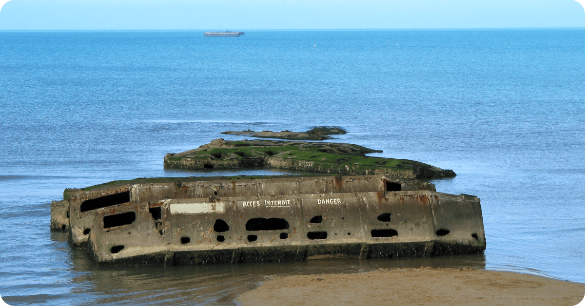 The ruins of the Normandy landing jetties become visible as the tide goes out.